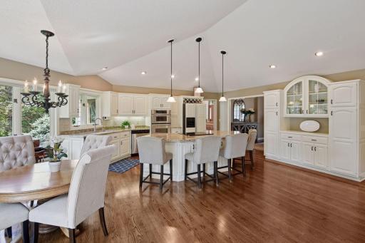 Spacious kitchen provides informal dining space and plenty of cabinets for storage