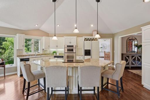 The large center island anchors the open kitchen space