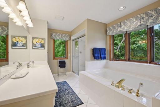 Spacious primary bath with separate walk-in shower and large whirlpool tub