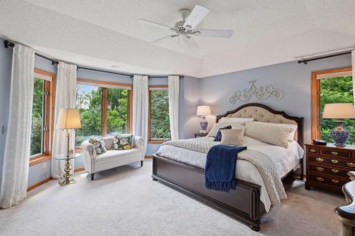 The sanctuary of the main level primary suite is a peaceful place to start and end the day