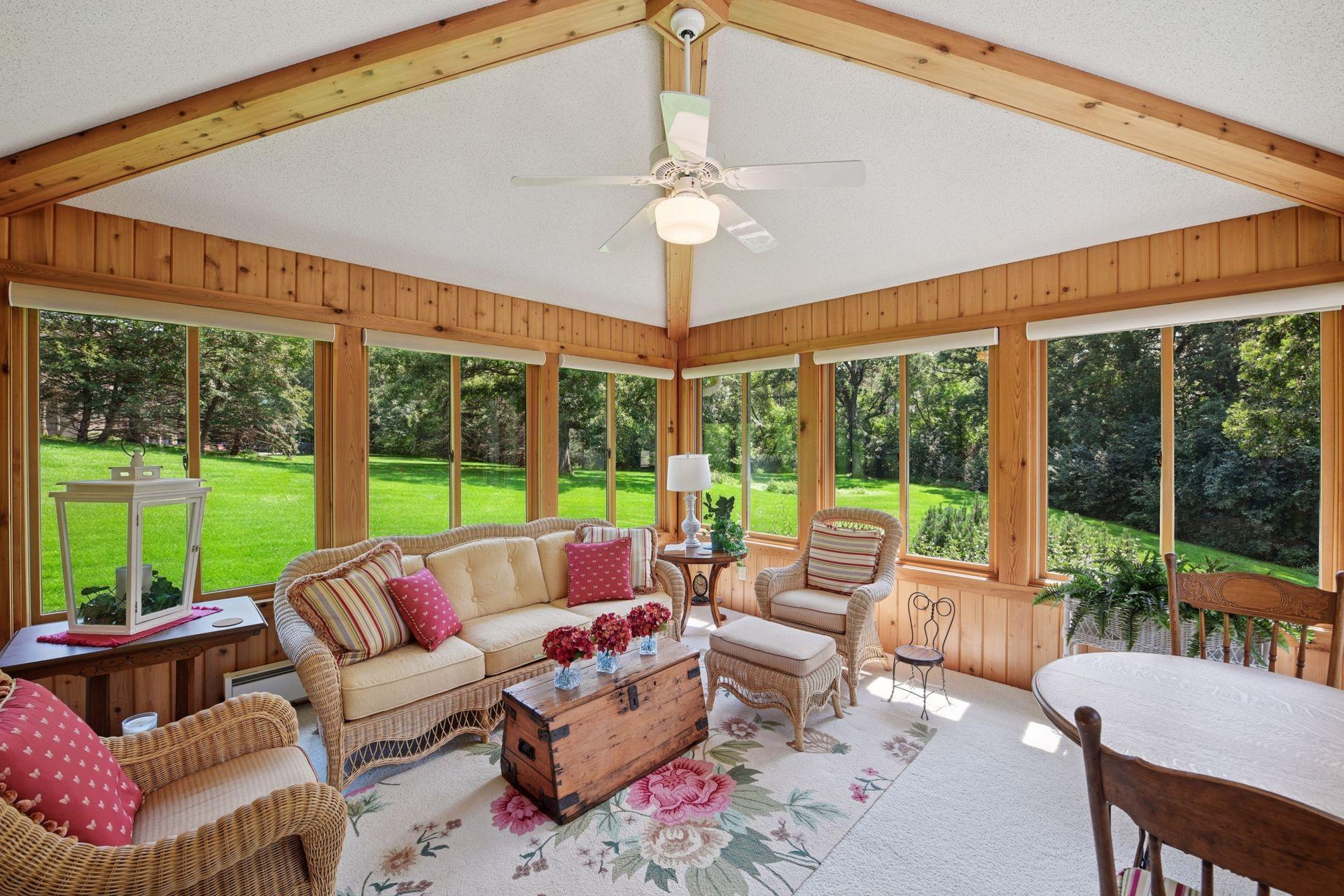 The sun room allows for year-round enjoyment of the surrounding nature and tranquility
