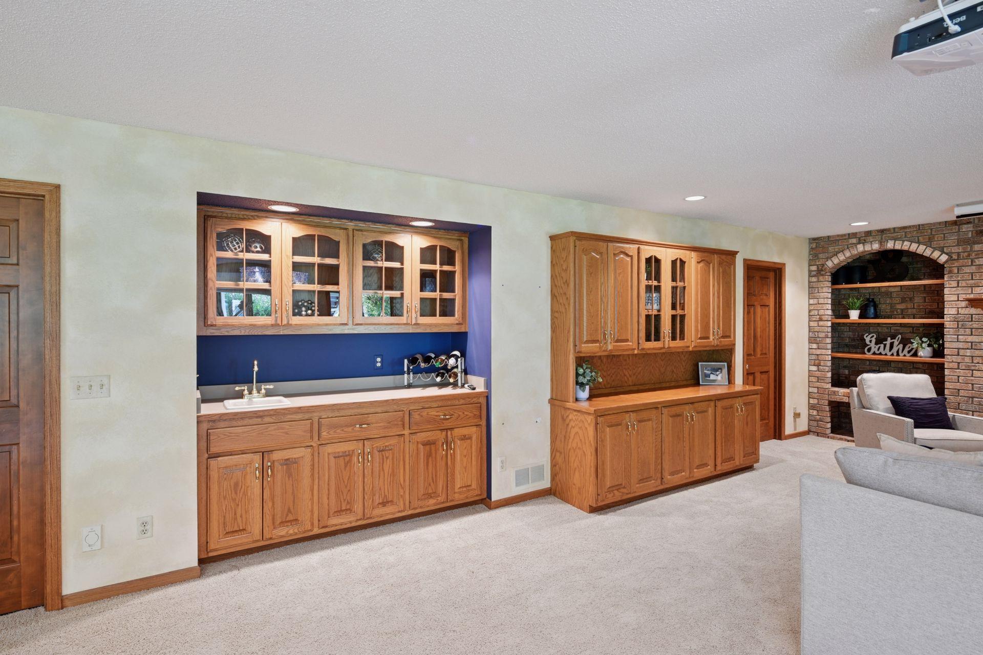 The wet bar and built-in cabinets come in handy when entertaining