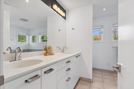 En-suite with jacuzzi tub and separate steam shower.