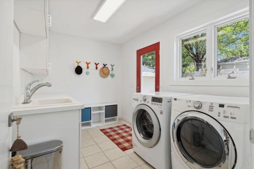 Main-floor laundry doubles as a mudroom for added convenience.