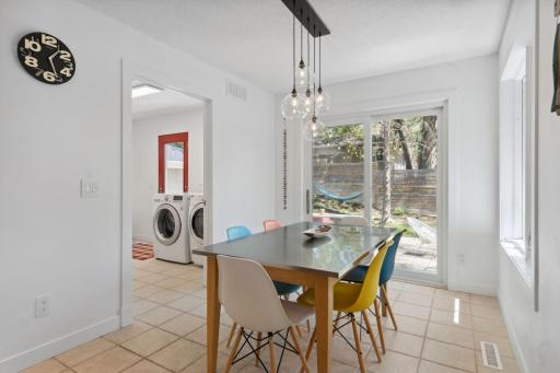 Step from the informal dining area onto a custom-built deckâideal for outdoor entertaining.