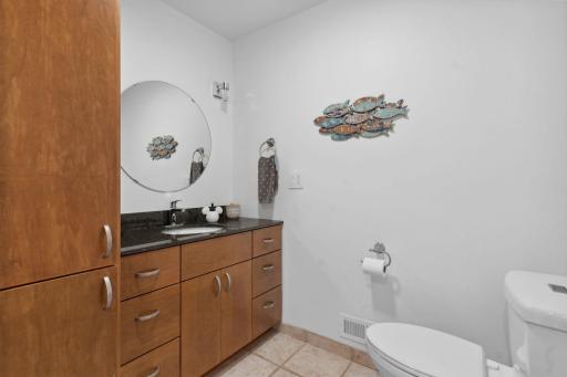 Main floor bathroom with ample storage and room to add a shower stall.
