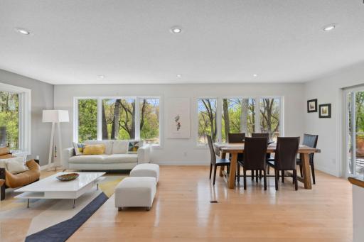Picture yourself in this spacious dining room with lake views and easy access to the side deck, perfect for relaxing or entertaining.