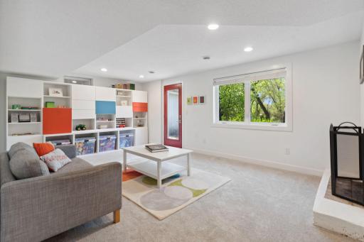 Bright and cozy lower-level family room with a fireplace and brand-new carpetâperfect for game nights or relaxing with a good book.