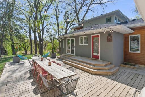 Step from the stunning custom deck into the informal dining room and kitchen through a new sliding door.