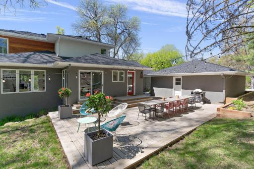 View from the side of the home featuring modern wood siding installed in 2019 and a new roof added in 2023!