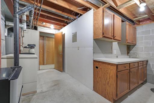 Spotless utility room with additional storage space!