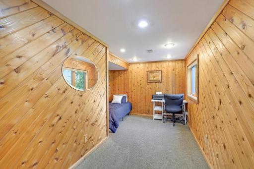 Fourth bedroom in the lower level is a perfect space for guests or in-home office.