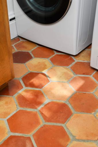 Beautifully maintained original clay tile in laundry.