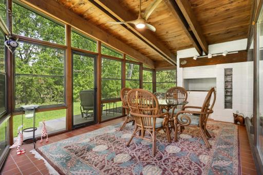 Fabulous sun room to escapes the mosquitos! Fireplace is capped in this room and can be converted back to wood burning.