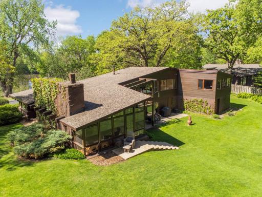 Nice large, flat yard with natural wetlands behind and lake views in front.
