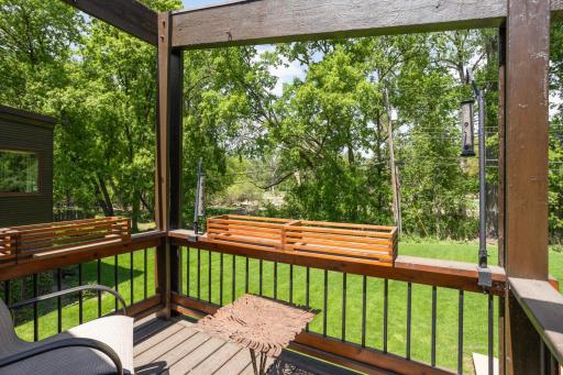 Deck off office overlooks nature and wetlands.