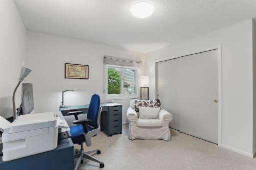 Third main-level bedroomâcurrently set up as a home office, offering flexibility to suit your needs.