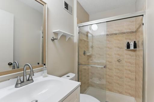 Private Â¾ bath with a new vanity and updated fixtures for a fresh, modern touch.