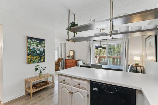 Durable and easy-to-maintain Corian countertops offer a smooth, seamless workspace in the kitchen.