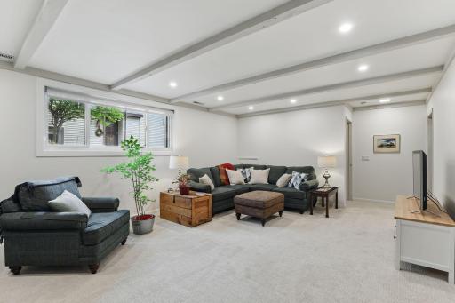 Another view of the family room showcasing fresh paint and new carpet for a clean, updated feel.