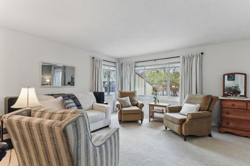 Bright and inviting living room with several newer windows letting in tons of natural light.