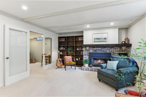 Recessed lighting adds a modern touch, and French doors lead to a separate office or flex space.