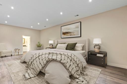Spacious lower-level bedroom with private en suite bathroom.