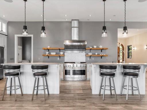 Custom-made kitchen with double islands and plenty of cabinet storage.