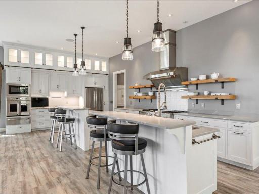 Custom-made kitchen with double islands and plenty of cabinet storage.