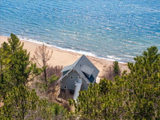 Beach house right on the lake with pristine sandy beach!