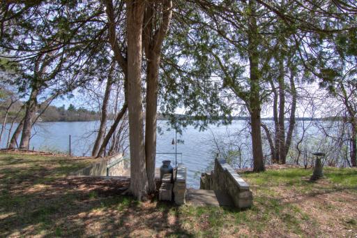 The boathouse is located on the east side of the property. Enjoy open patio space on top. Decent concrete stairs leading down to the water's edge.