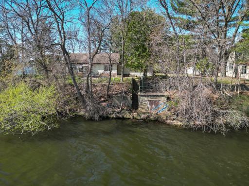 A view of the boathouse from the water showing the patio above as well!