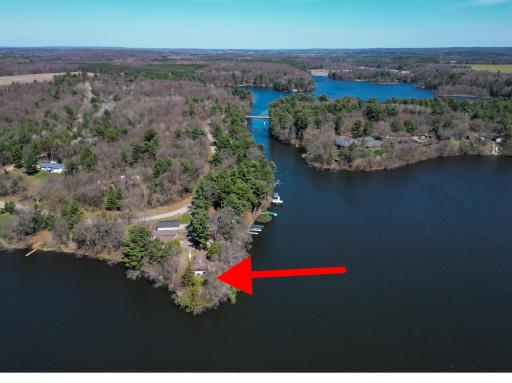 Located on Upper Tainter on a peninsula! The property affords panoramic views in the living room and water frontage on (3) sides. Two sets of stairs leading to the water exist. Very unique property!
