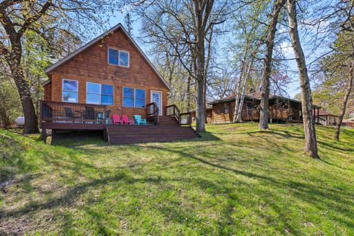 Two homes, a 28x30 newer storage shed and 151 feet of hard sand lake front on beautiful Lake Ida