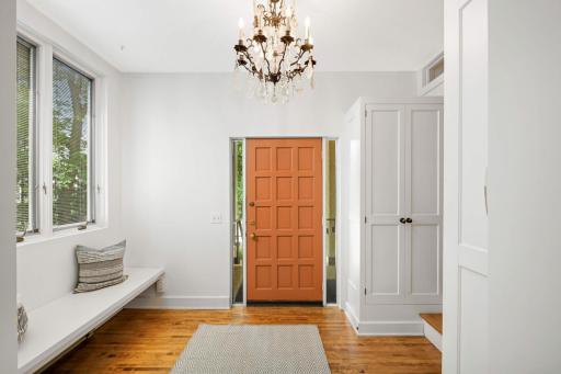 Spacious street side foyer with bench and 2 closets