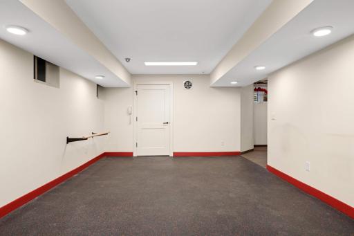 The lower level offers an exercise/ play room room
