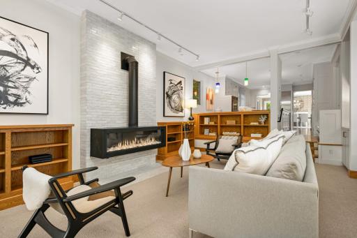 Awesome gas fireplace flanked by built-ins