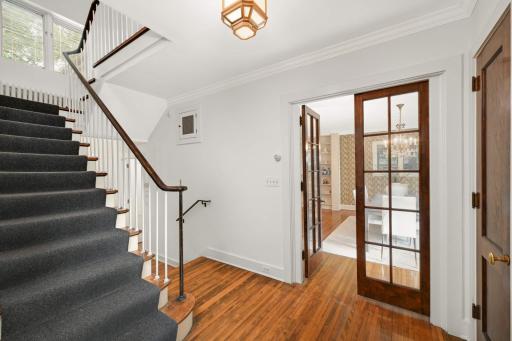 Foyer, staircase & French doors to the dining room