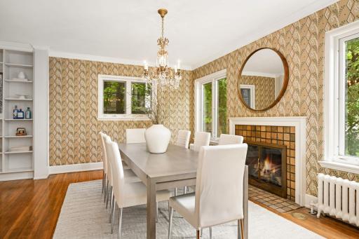 The spacious formal dining room features a gas log fireplace