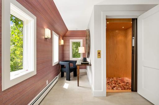 The Elevator landing off the Primary Bedroom has a desk area