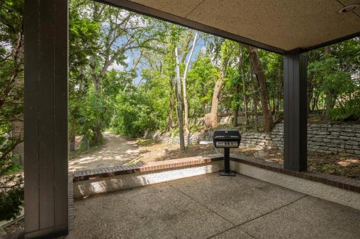 Exposed aggregate covered patio and BBQ off the family room