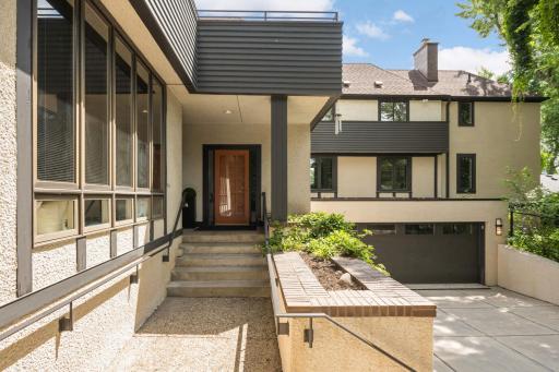 The street side covered entryway with planters