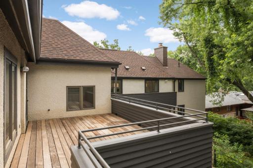 a large balcony off the hallway with ironwood decking