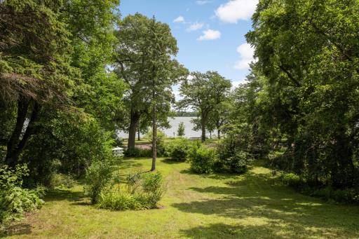 A huge front lawn to the lake on a .56 acre site
