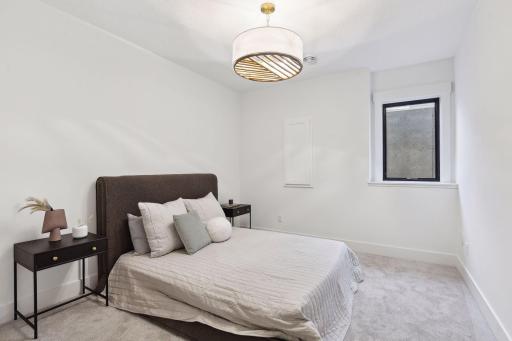 The lower level includes a fifth bedroomâideal for guests or visitors, offering them plenty of space and privacy.