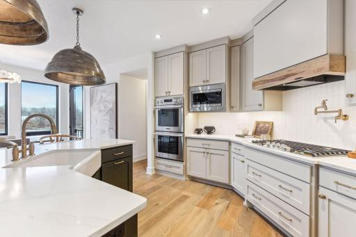 Well-equipped, the Kitchen features a stainless steel appliance package from Signature Kitchen Suite and includes Wi-Fi enabled double wall ovens and a smart refrigerator.