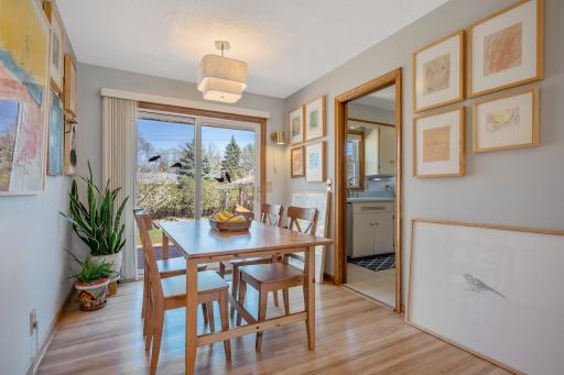 Dining Room with Sliding Glass Door onto backyard Deck Doorway into Kitchen