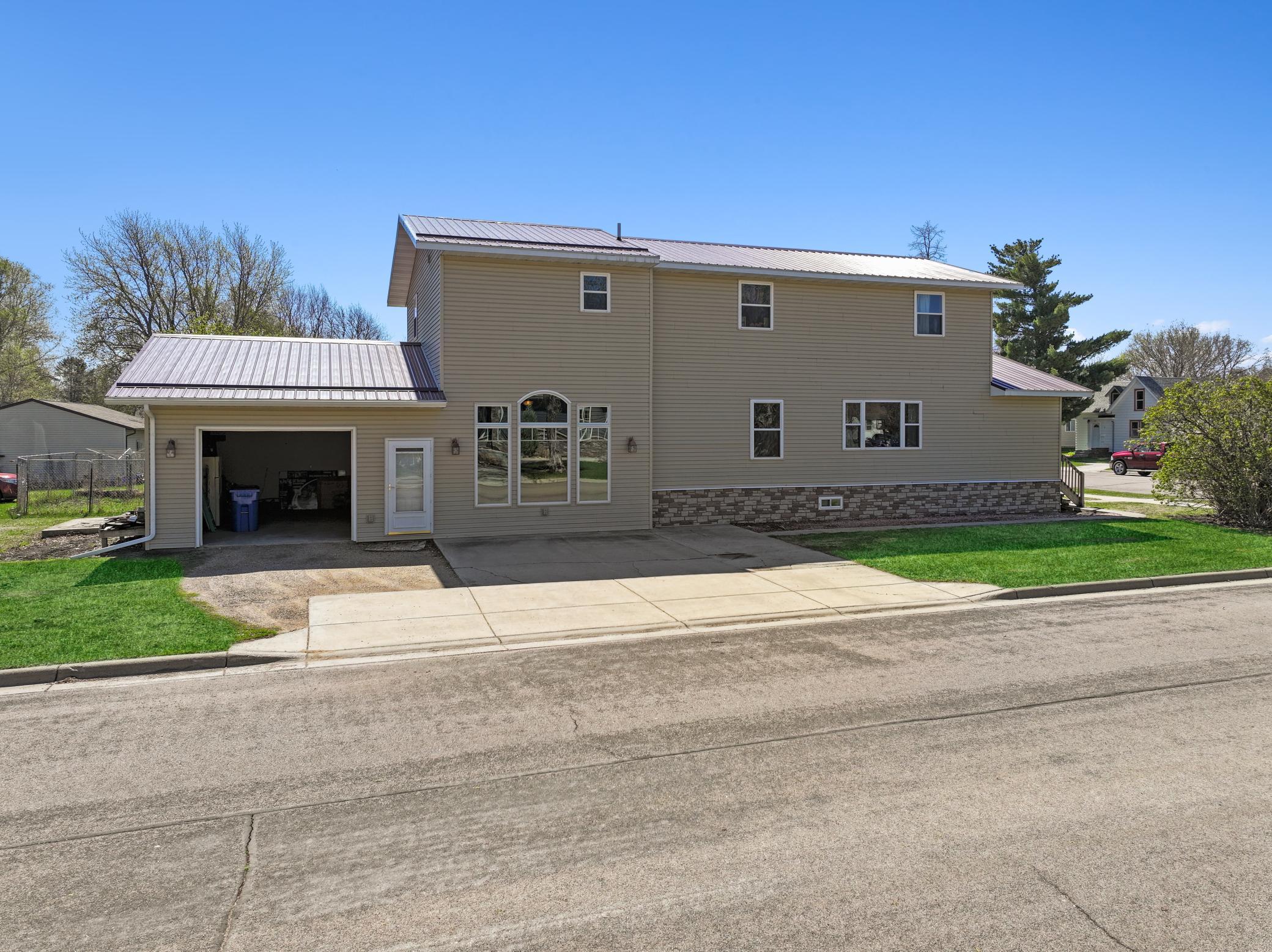 Side view - updated siding and metal roof
