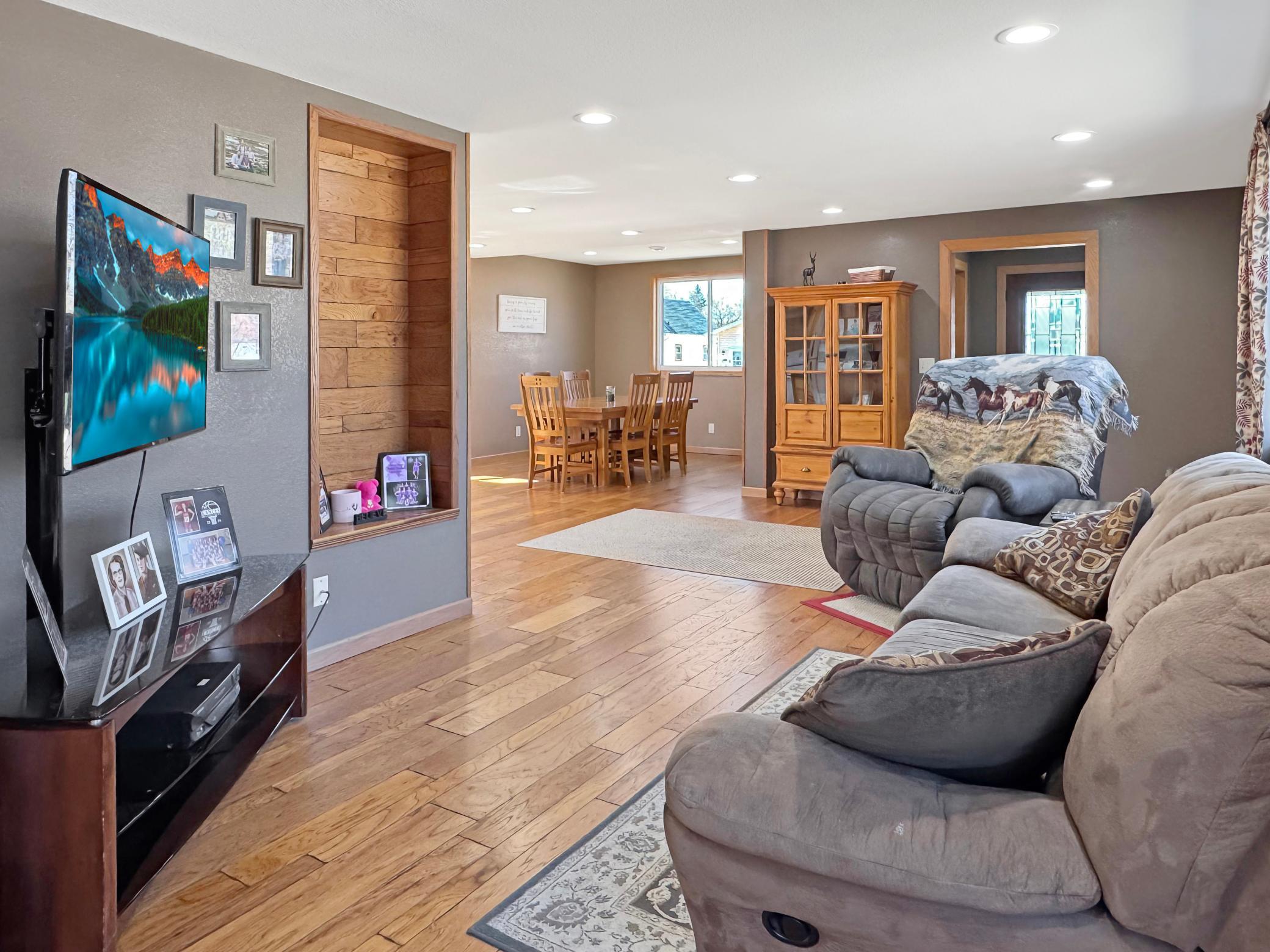 Living room with open concept to dining area and kitchen