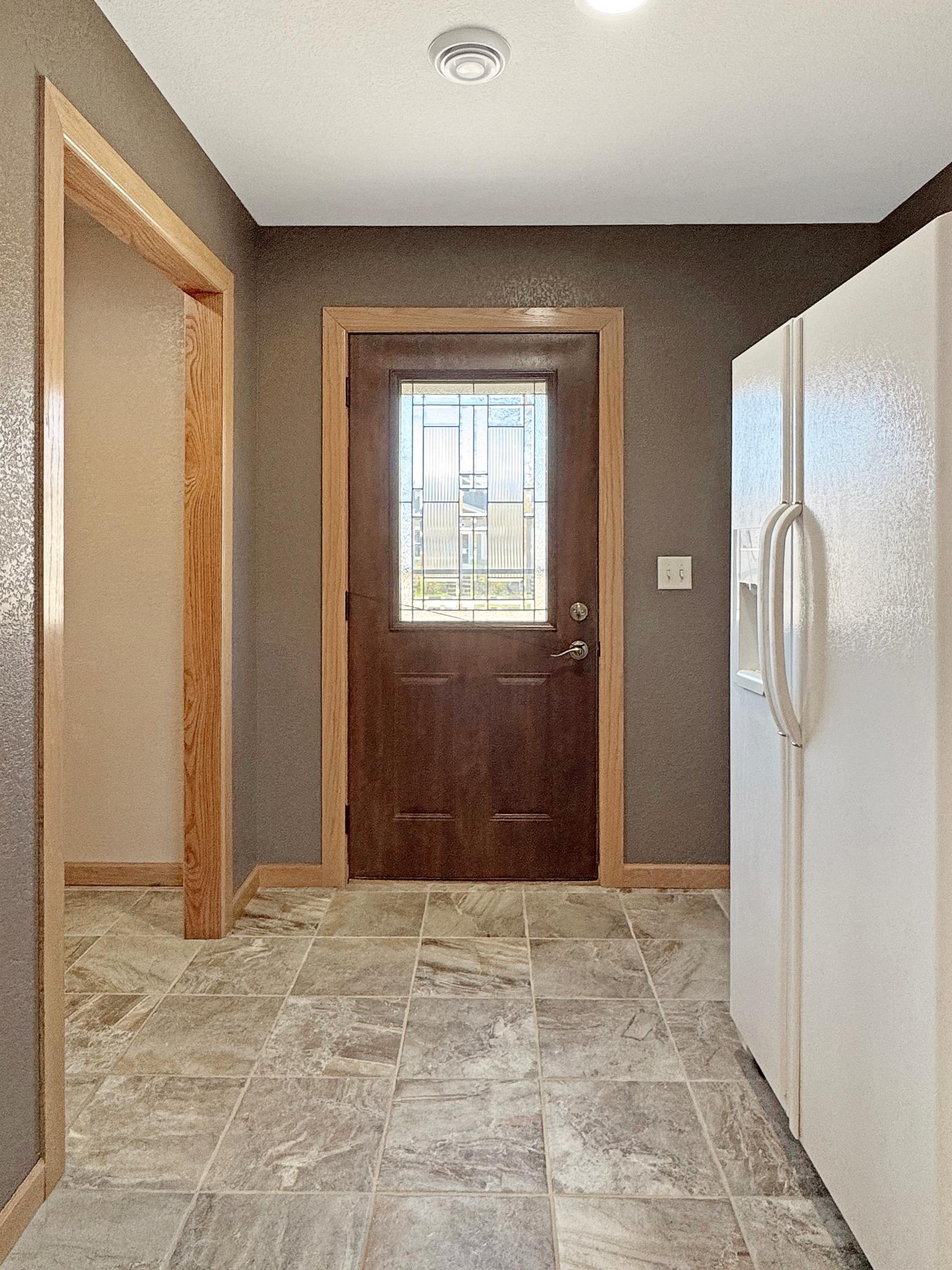 Street side entrance, larger than picture looks! With stackable laundry on left side